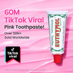 Pink toothpaste tube close-up showing branding