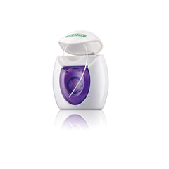Soft waxed dental floss sliding between teeth