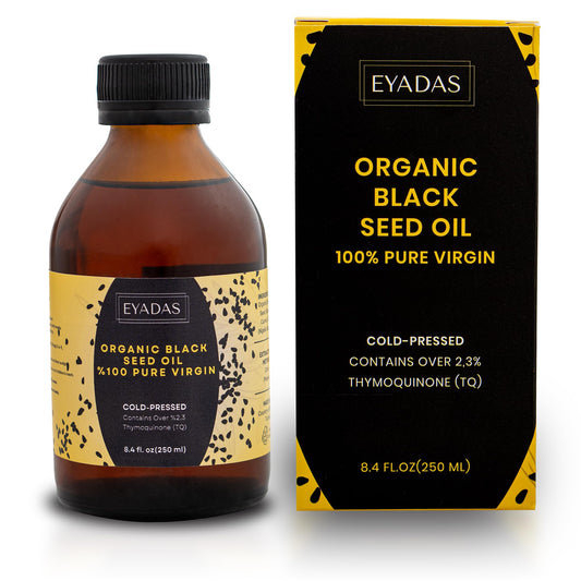 Front view of EYADAS Organic Black Seed Oil in amber glass bottle