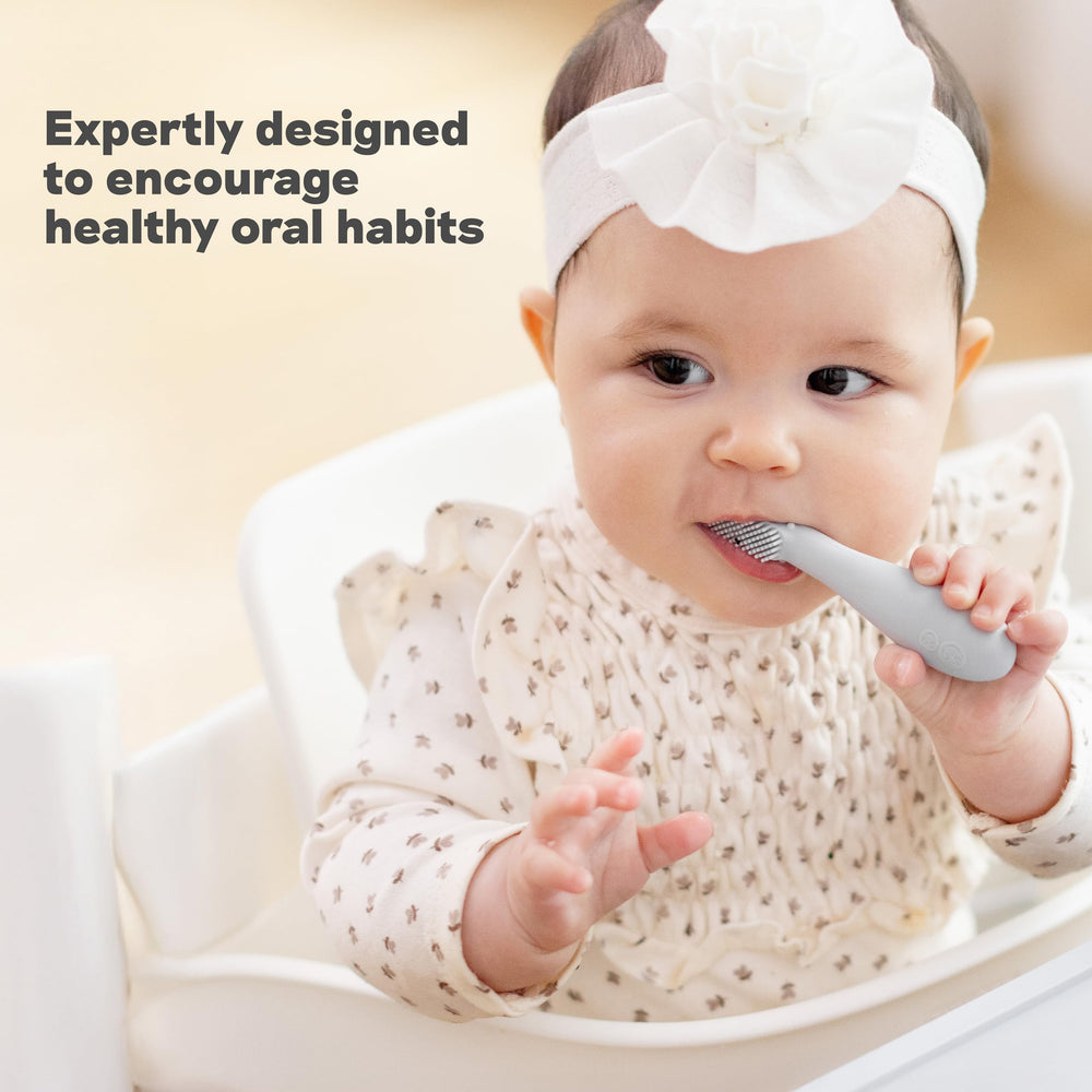 Baby using ezpz Baby-Led Toothbrush Pewter