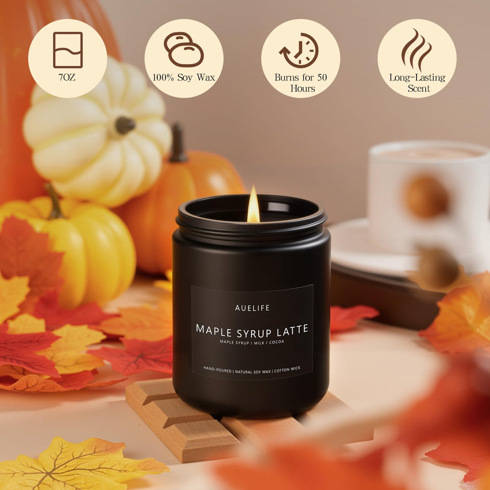 Candle in fall decor setting with warm autumn lighting