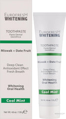 Toothpaste being dispensed onto a toothbrush