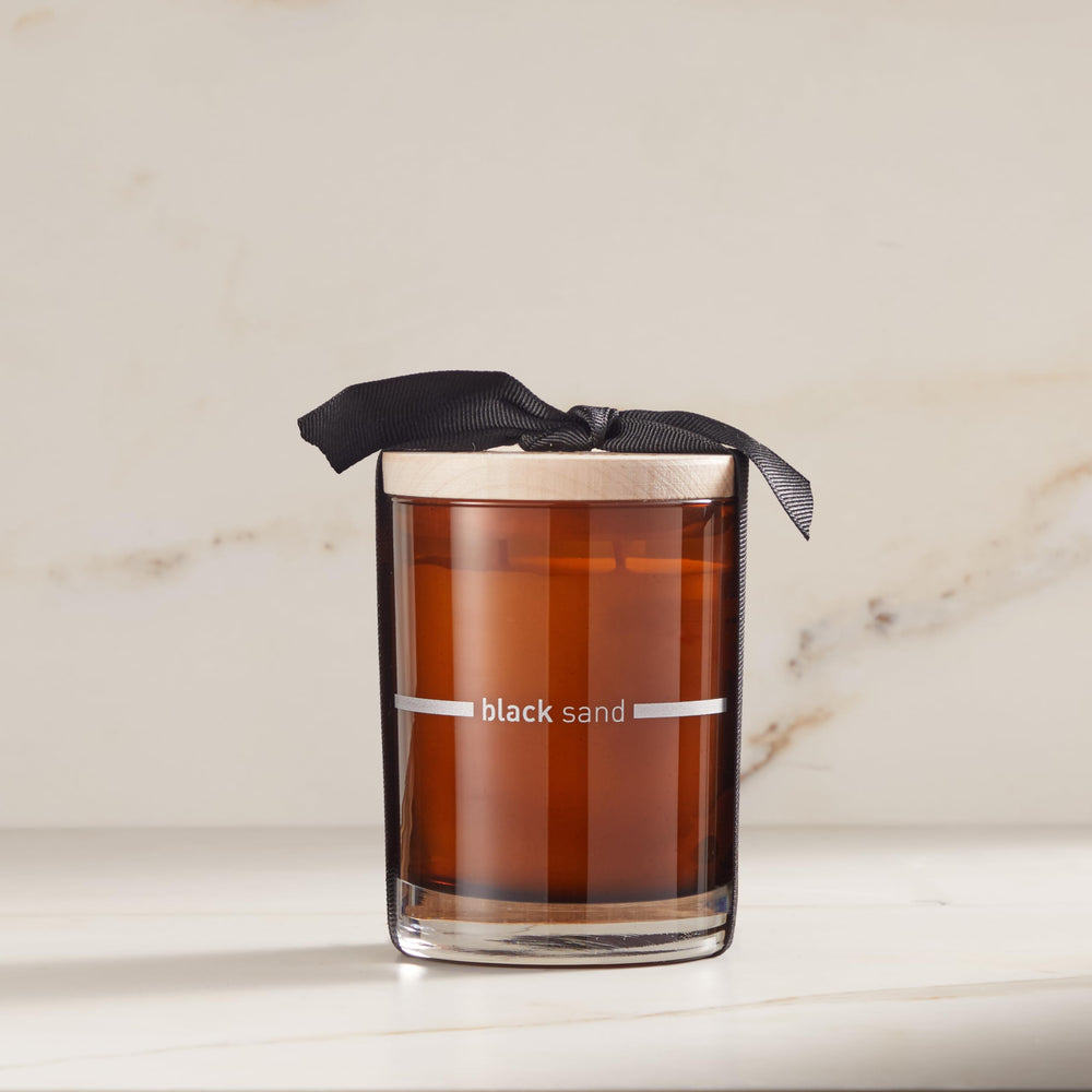 FINN & CO Black Sand candle double-wick burn for even fragrance release.