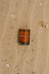 FINN & CO Black Sand candle lit glow for sunset mood.