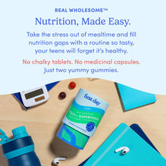 Teen taking vitamins as part of morning routine
