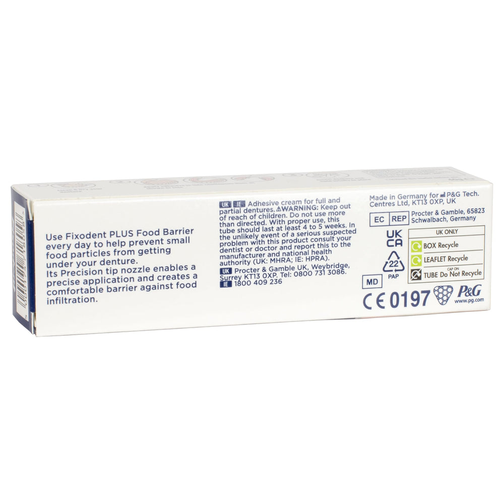 Denture adhesive cream being applied to dentures