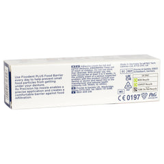 Denture adhesive cream being applied to dentures