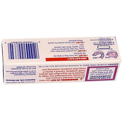 Close-up of adhesive being applied to dentures