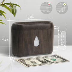 Aromatherapy diffuser glowing as night light in dark wood grain