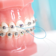 Close-up of threaders ready for cleaning around implants