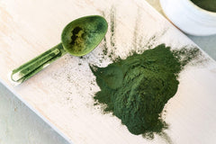 Chlorella powder sprinkled on a salad