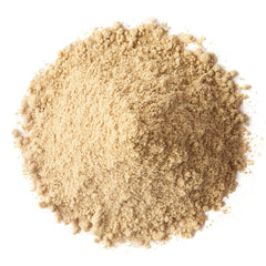 Close-up of red, yellow, and black maca powder