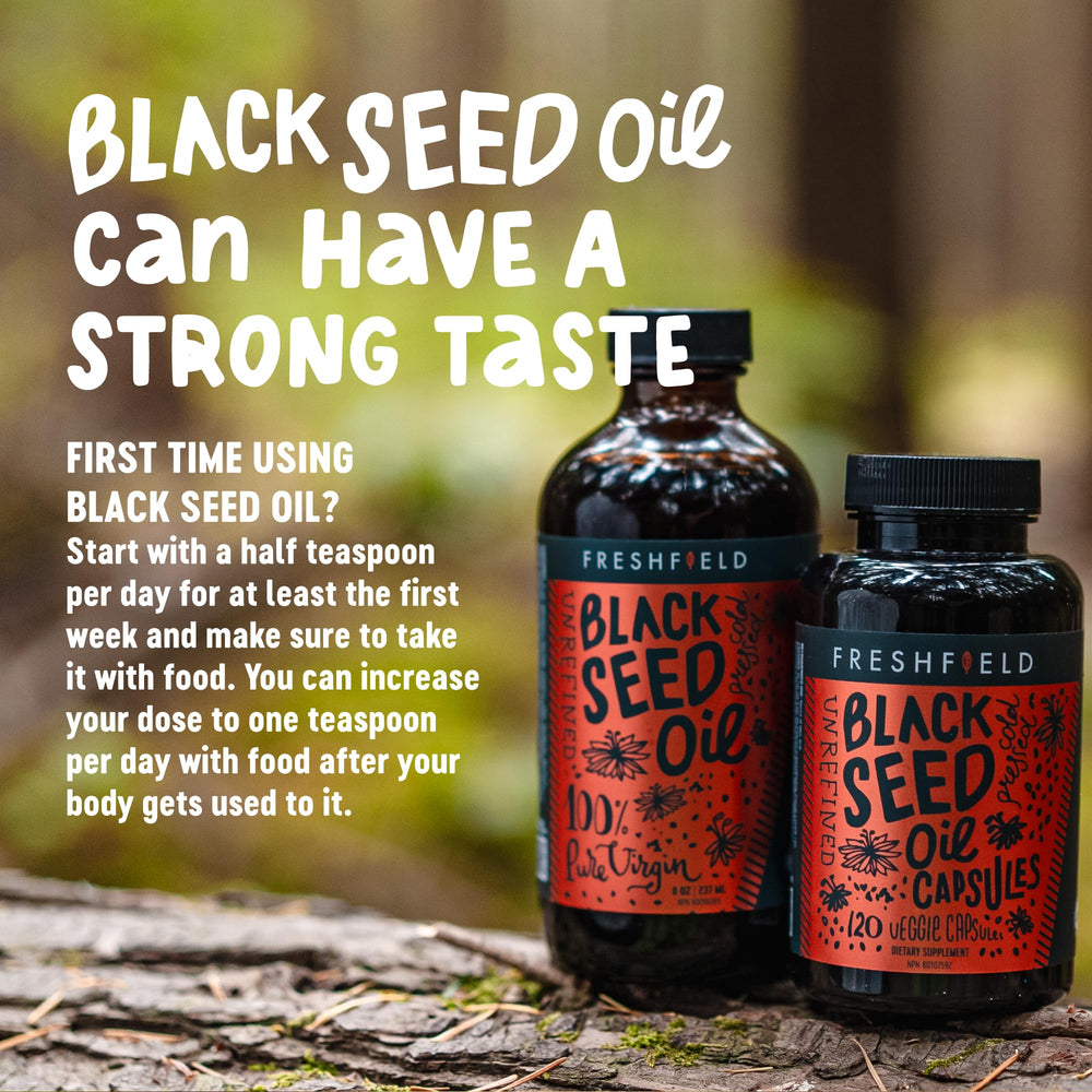 Pouring Freshfield Black Seed Oil from a dropper