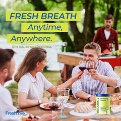Hands holding Freshmile travel mouthwash tablets for on-the-go use