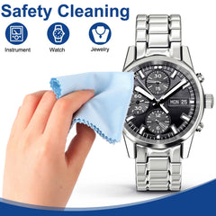 Electronic devices such as smartphones and tablets being wiped with blue microfiber cloth