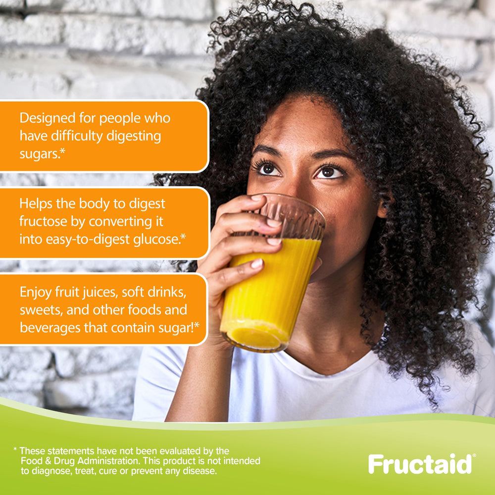 Fructaid travel bottle on a desk with snacks and beverages