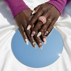 Furnunubi geometric ombre nails with bold black dots for modern flair.
