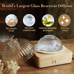 Close-up of hand-blown glass reservoir and wood base