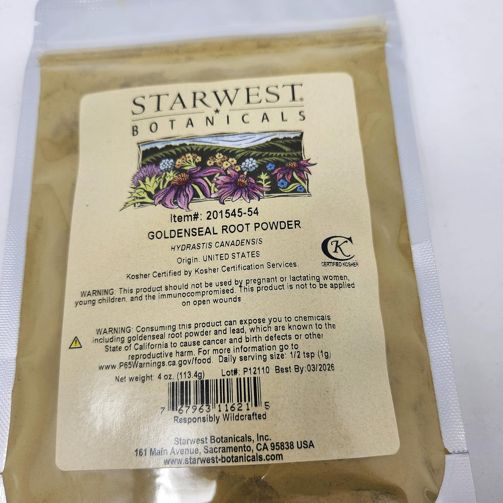 Assorted herbal powders including goldenseal on wooden surface