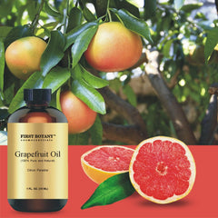 Grapefruit essential oil bottle with packaging and botanicals