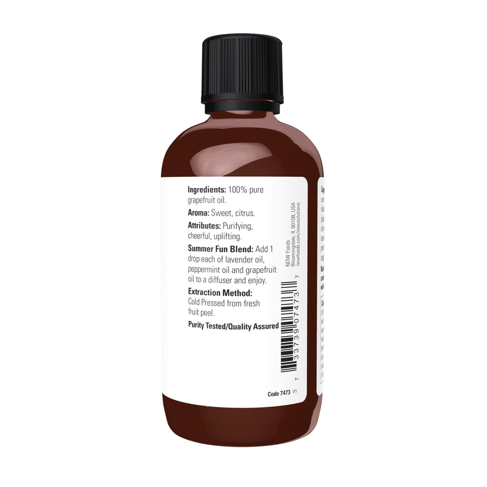 Grapefruit essential oil bottle side view - 100% pure