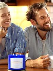 Side view of Grapefruit Passionfruit Sunset candle with lid