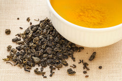 Deep golden liquor of steeped gunpowder green tea