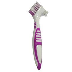 Denture brush with angled head and rubber handle