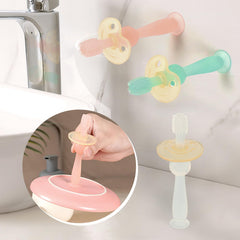 Toddler practicing self-brushing with the toothbrush