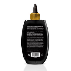 Hair Chemist Beard Oil drop close-up shows moisturizing formula for beard and scalp.