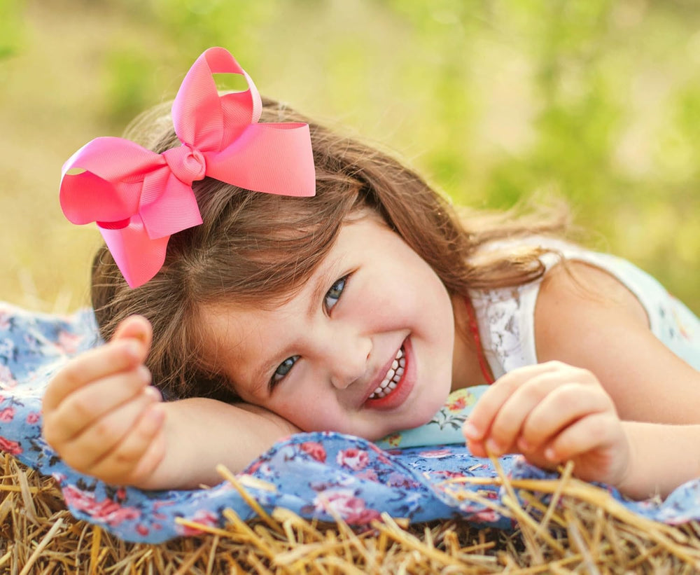 HAIRBOWS Colorful grosgrain bow packaged for gifting or storage.