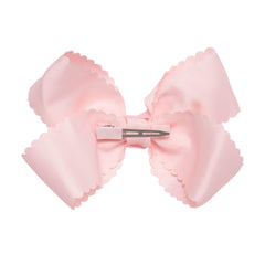 Hairbows grosgrain scalloped-edge bow clip closeup highlights vibrant color and texture.