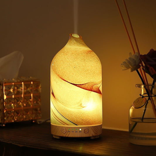 Close-up of hand-blown glass diffuser with brown rock pattern