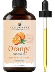 Amber glass bottle of Handcraft Blends Orange Essential Oil with dropper