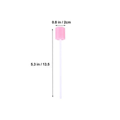 Close-up of pink disposable mouth swabs