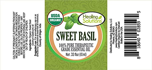 Close-up of Sweet Basil essential oil bottle label and dropper