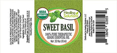 Close-up of Sweet Basil essential oil bottle label and dropper