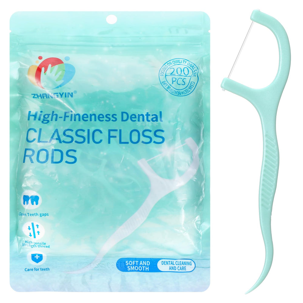Close-up of mint-flavored floss on the floss pick