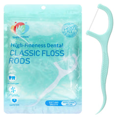 Close-up of mint-flavored floss on the floss pick