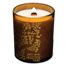 Close-up of wood wick in Hemlock Park Amber Gold Leaf Glass Candle