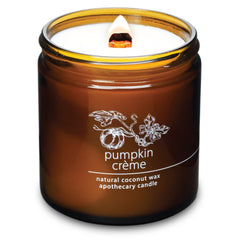 Hemlock Park candle in amber glass jar with crackling wooden wick