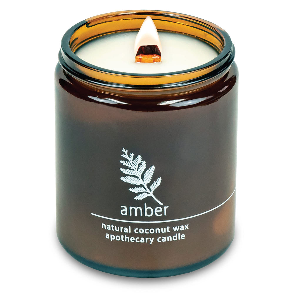 Hemlock Park crackling wood wick candle in an amber 8 oz jar