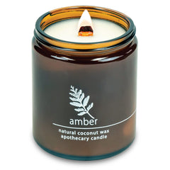 Hemlock Park crackling wood wick candle in an amber 8 oz jar
