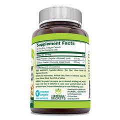 Close-up of turmeric and ginger capsules in bottle