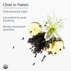 Close-up of black seed oil capsules showing rich oil