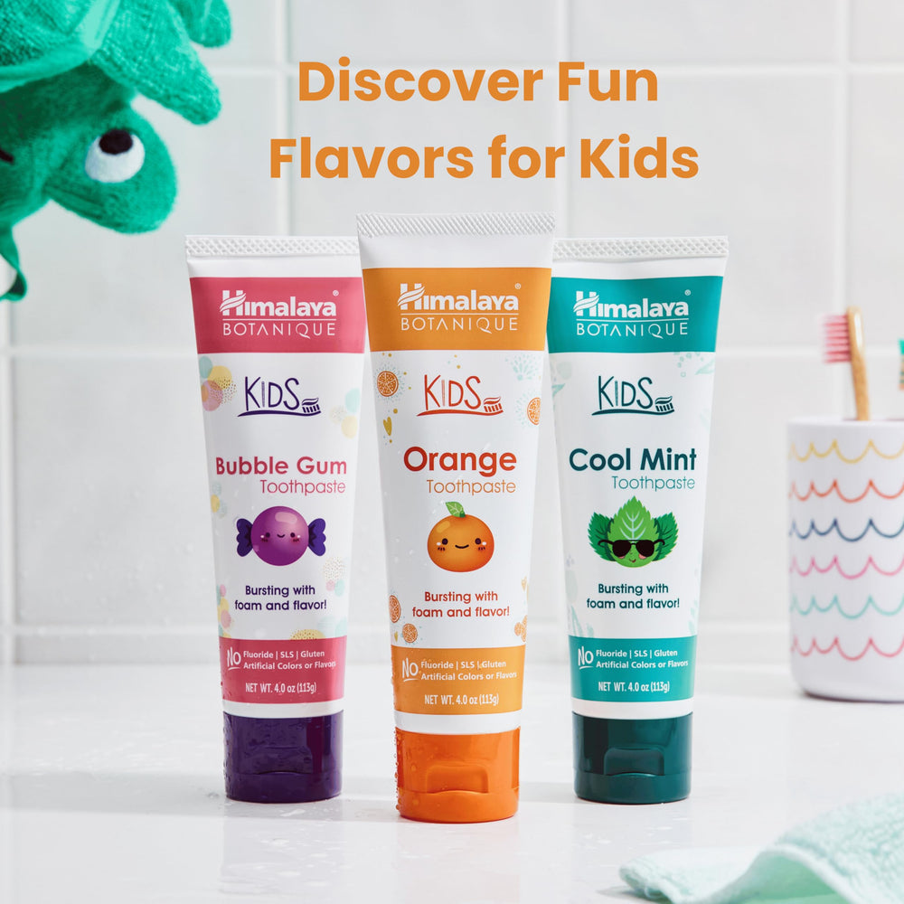 Toothbrush with Himalaya Botanique Kids Toothpaste orange flavor being used