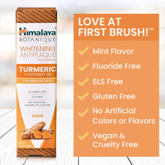 Golden turmeric root beside toothpaste for whitening