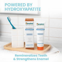 Toothpaste being applied to a toothbrush for remineralization benefits