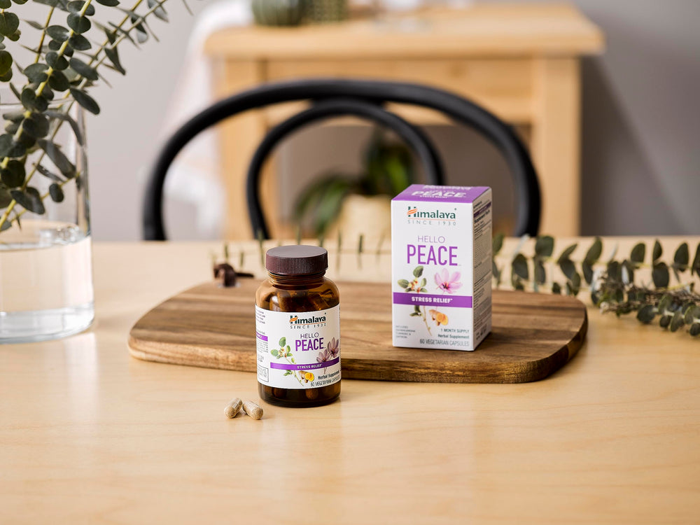 Packaging and bottle on wooden surface