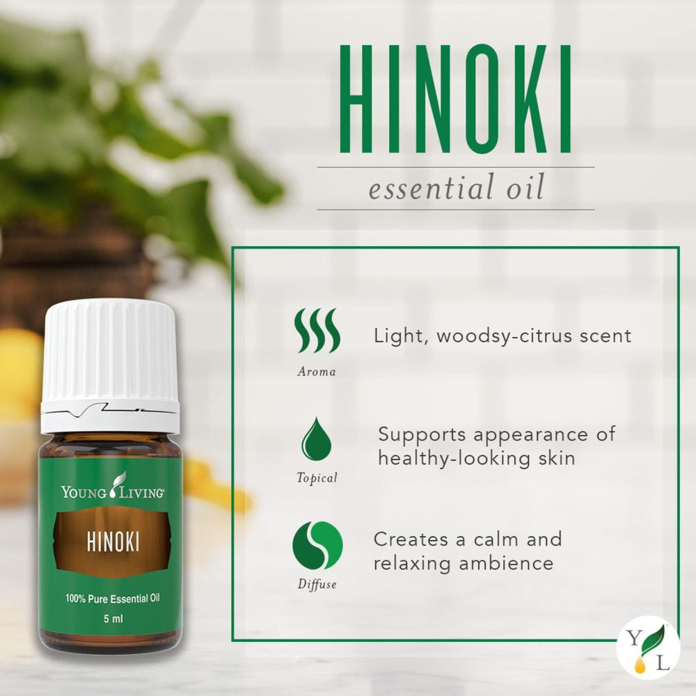 Young Living Hinoki essential oil diffuser at a work desk for focus.